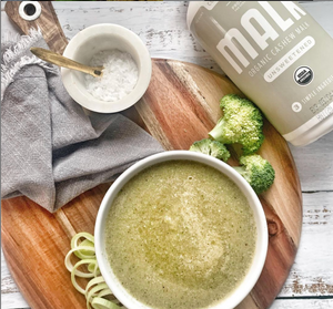 image of broccoli soup with Malk brand cashew milk and salt on a cutting board