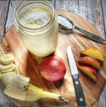 Load image into Gallery viewer, Image of pear and banana smoothie on cutting board
